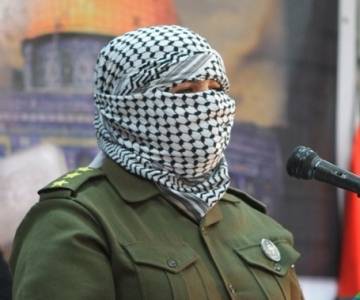 شاعرة ملثمة ابكت الحضور في حفل تأبين صدام بالكرك  صور