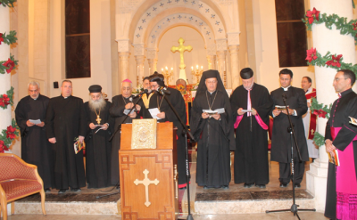 أغصان زيتون وشموع في الصلاة السنوية للوحدة والسلام