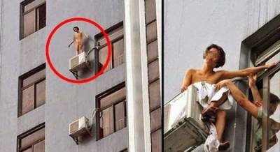 صينية تسبب فوضى لرقصها عارية على حافة نافذة فندق .. صورة