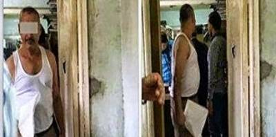 موظف حكومى يمارس عمله بملابسه الداخلية