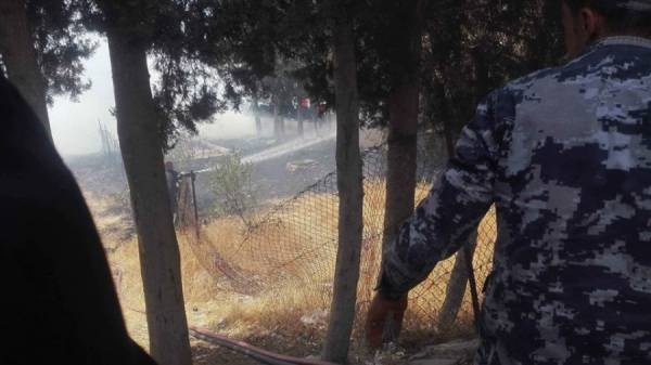 حريق داخل حرم كلية الحصن في إربد (صور)