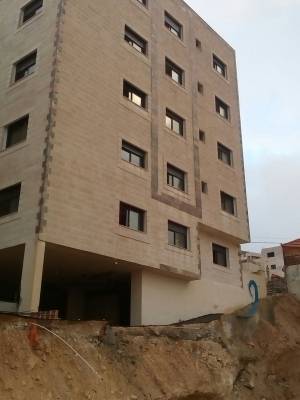 عمان.. اخلاء مبنيين آيلين للسقوط في القويسمة  صور