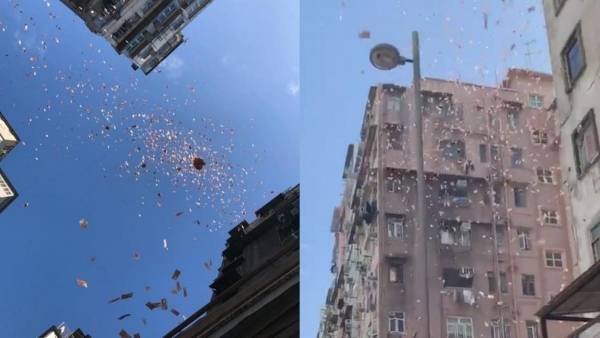 بالصور .. السماء تمطر مالاً في هونغ كونغ ..