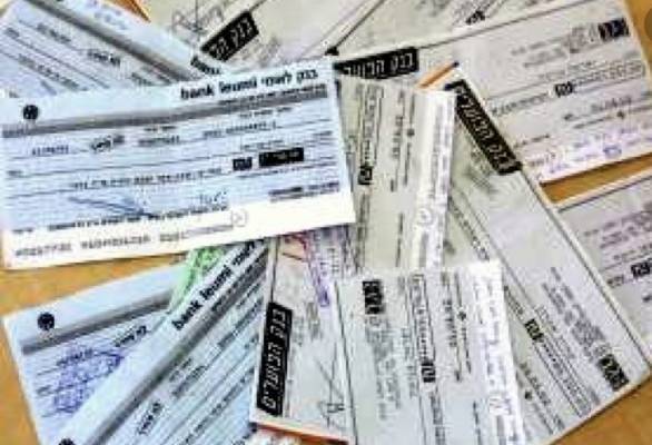 النواب  والغرف التجارية والصناعية يتآمرون على التجار ويستثنون الشيكات من العفو