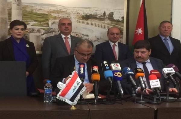 التوقيع على اتفاقيات النقل البري الاردني العراقي