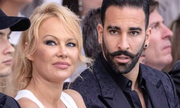 (باميلا أندرسون تعلن انفصالها عن لاعب كرة القدم الفرنسي عادل رامي)