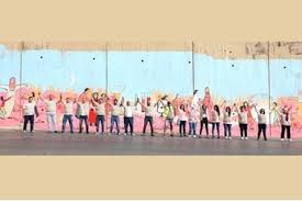 بنك الإسكان يشارك في رسم جدارية للتوعية بمرض سرطان الثدي