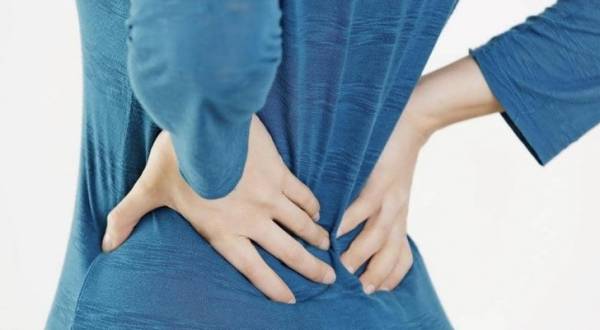 ما علاقة آلام الظهر بالأسنان؟