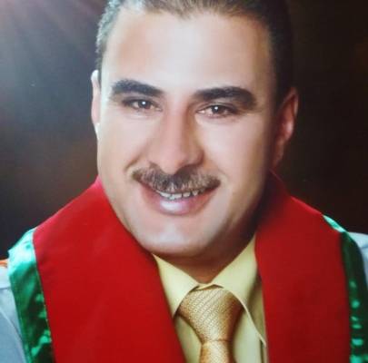 محمد الراميني يبارك للدكتور عاطف العواملة الترقية